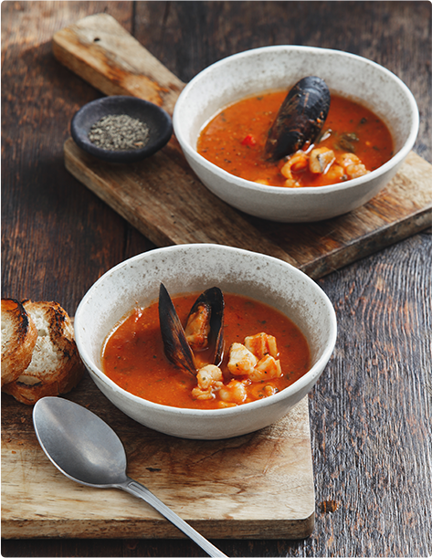 Two bowls of Manhattan clam chowder soup