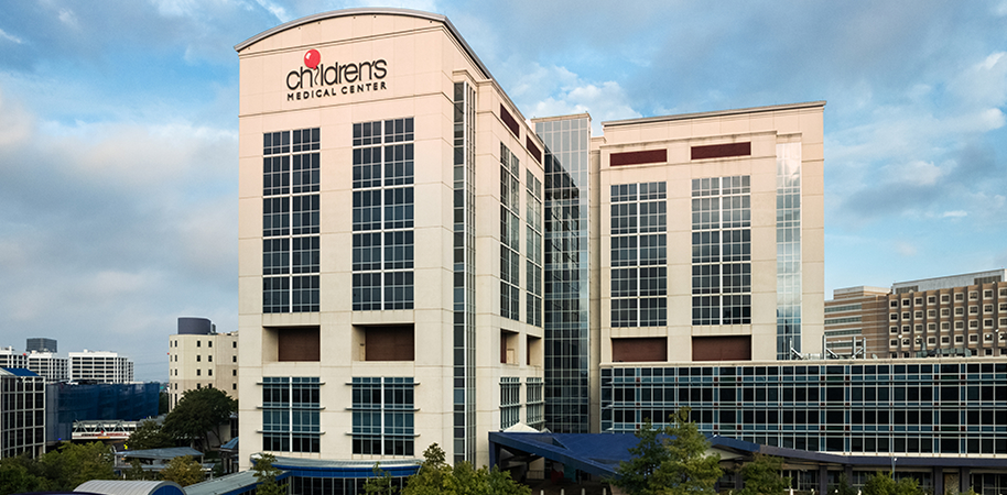 Children's Health, a modern high-rise hospital with glass windows.